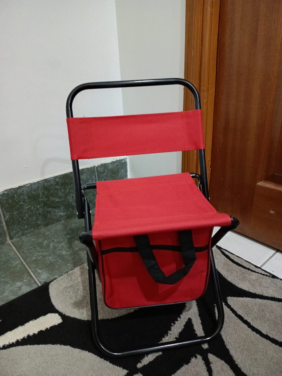 Foldable camping chair with storage pouch