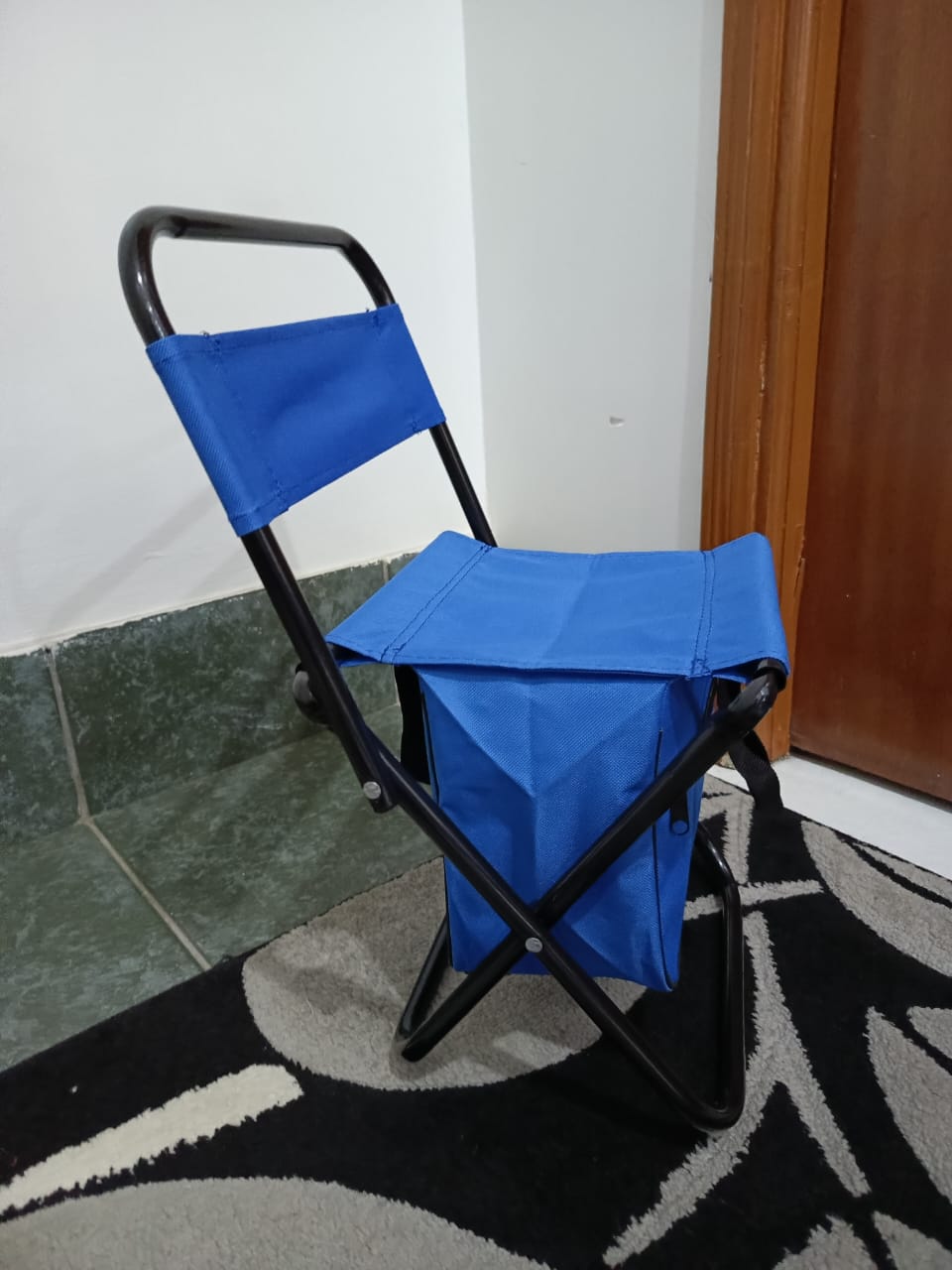 Foldable camping chair with storage pouch